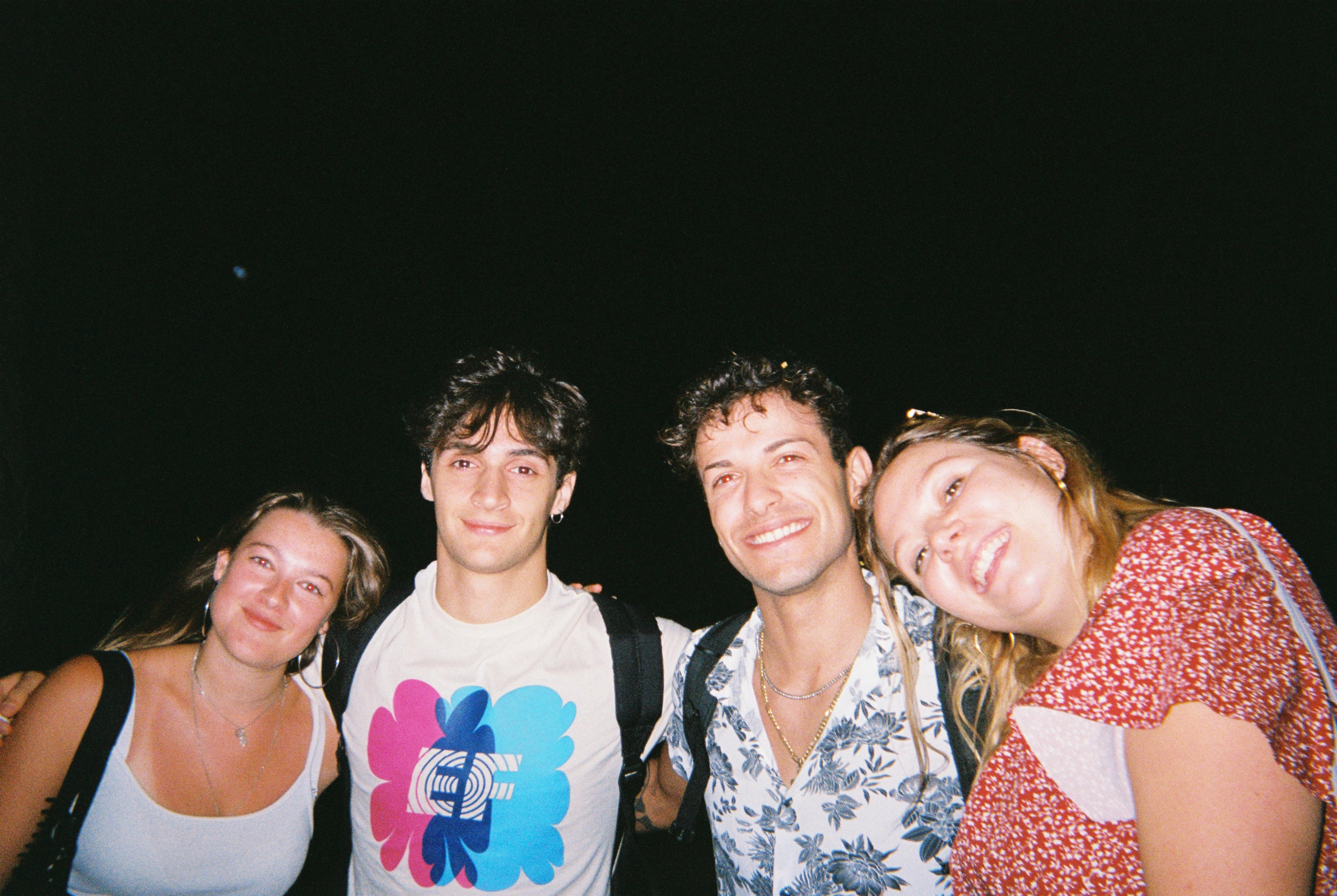 Students posing for a group photo during an evening outing