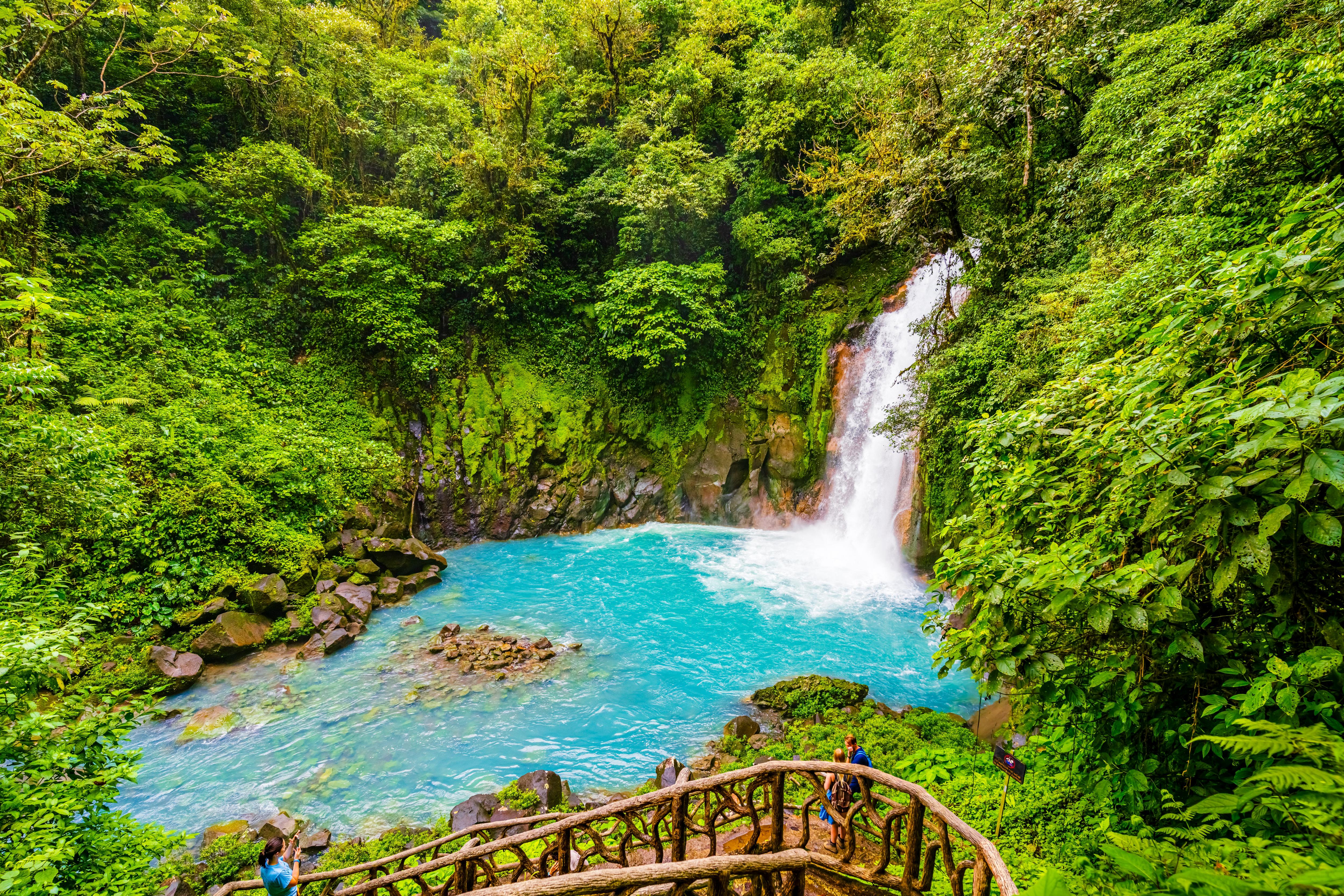 Students on a Rio Celeste Waterfall excursion, enjoying the vibrant blue waterfall
