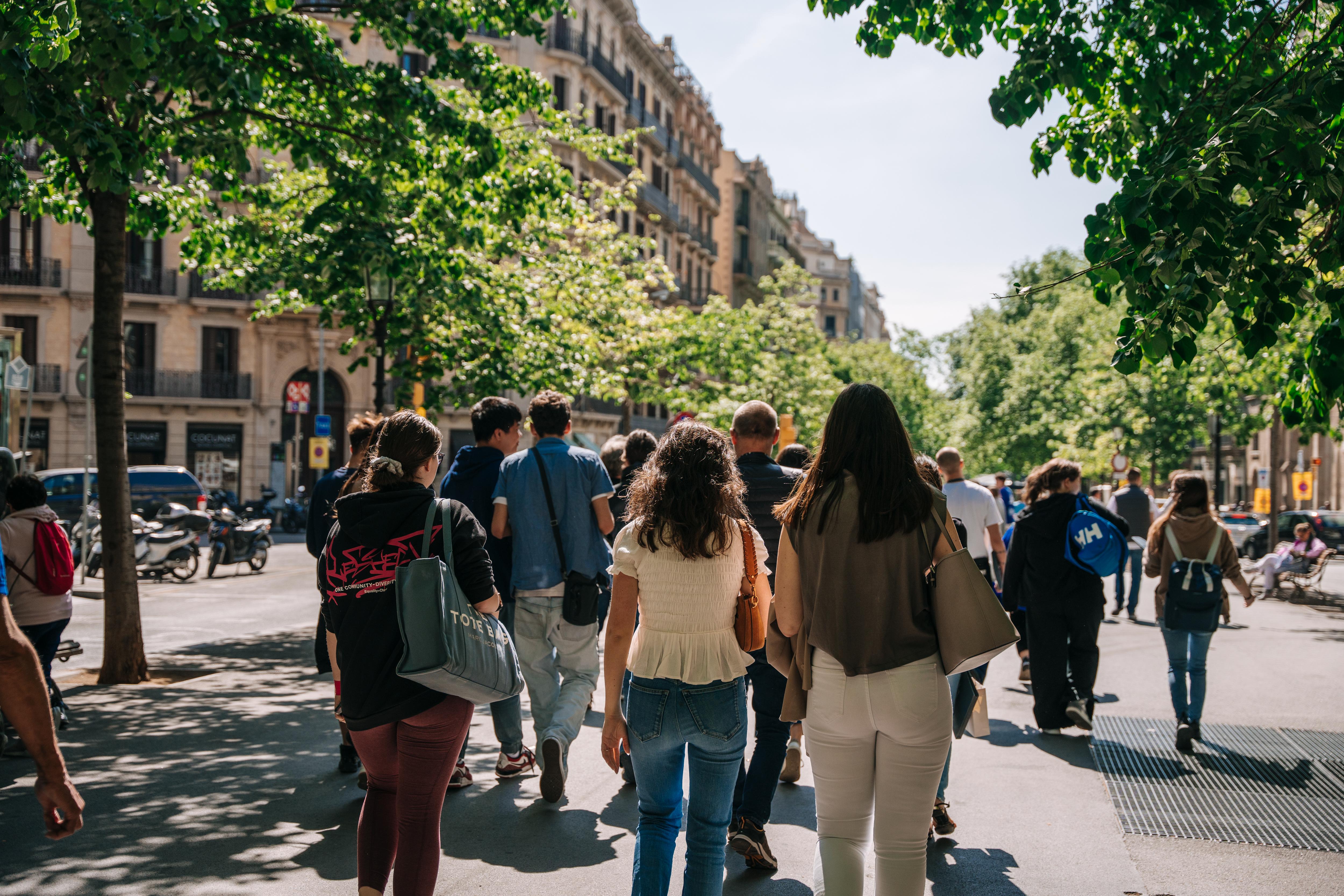Students explore a vibrant European city, enjoying a guided walk through lively streets and cultural landmarks