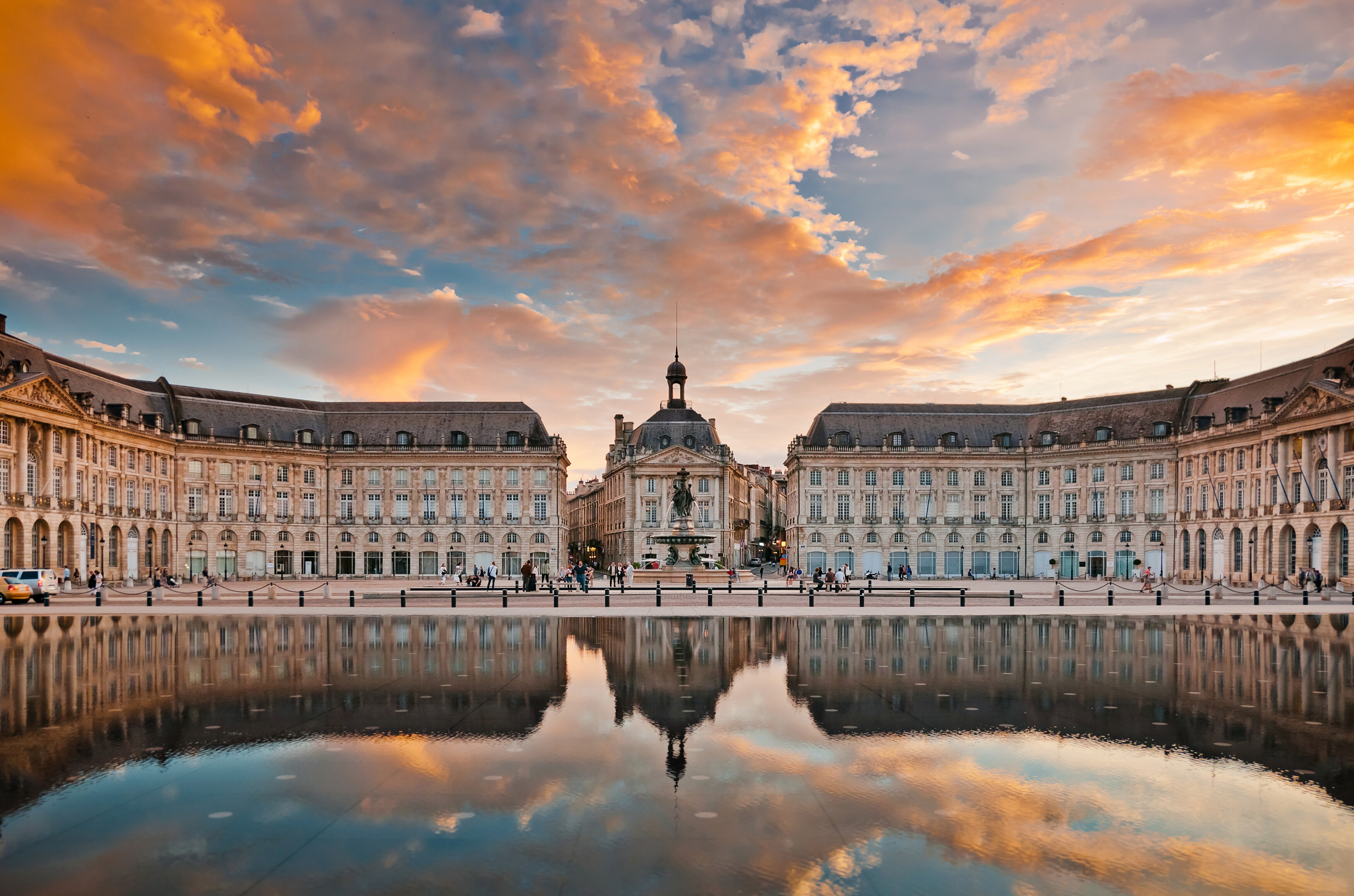 Place de la Bourse at sunset with stunning water reflections and historic architecture