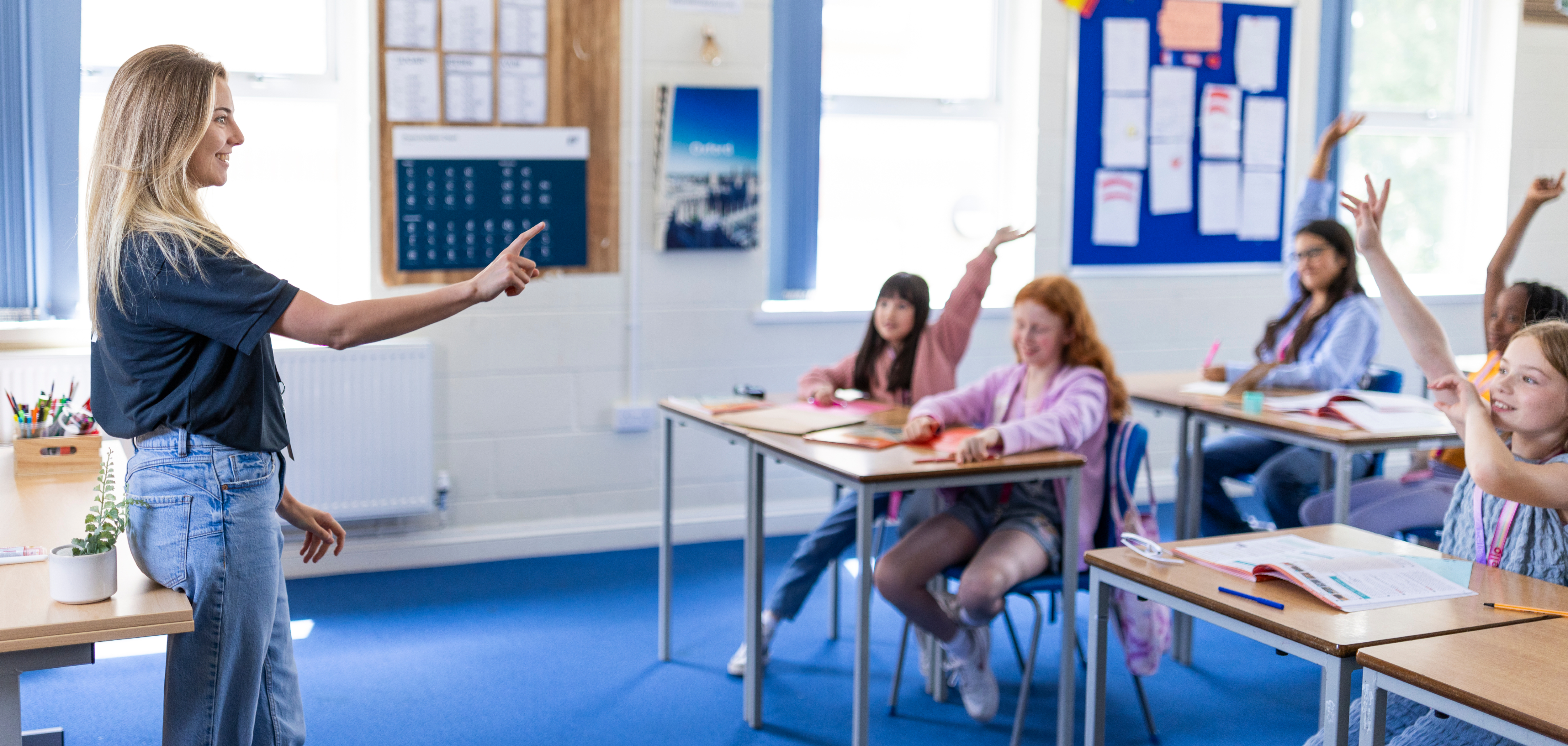 Staff And Students In Classroom