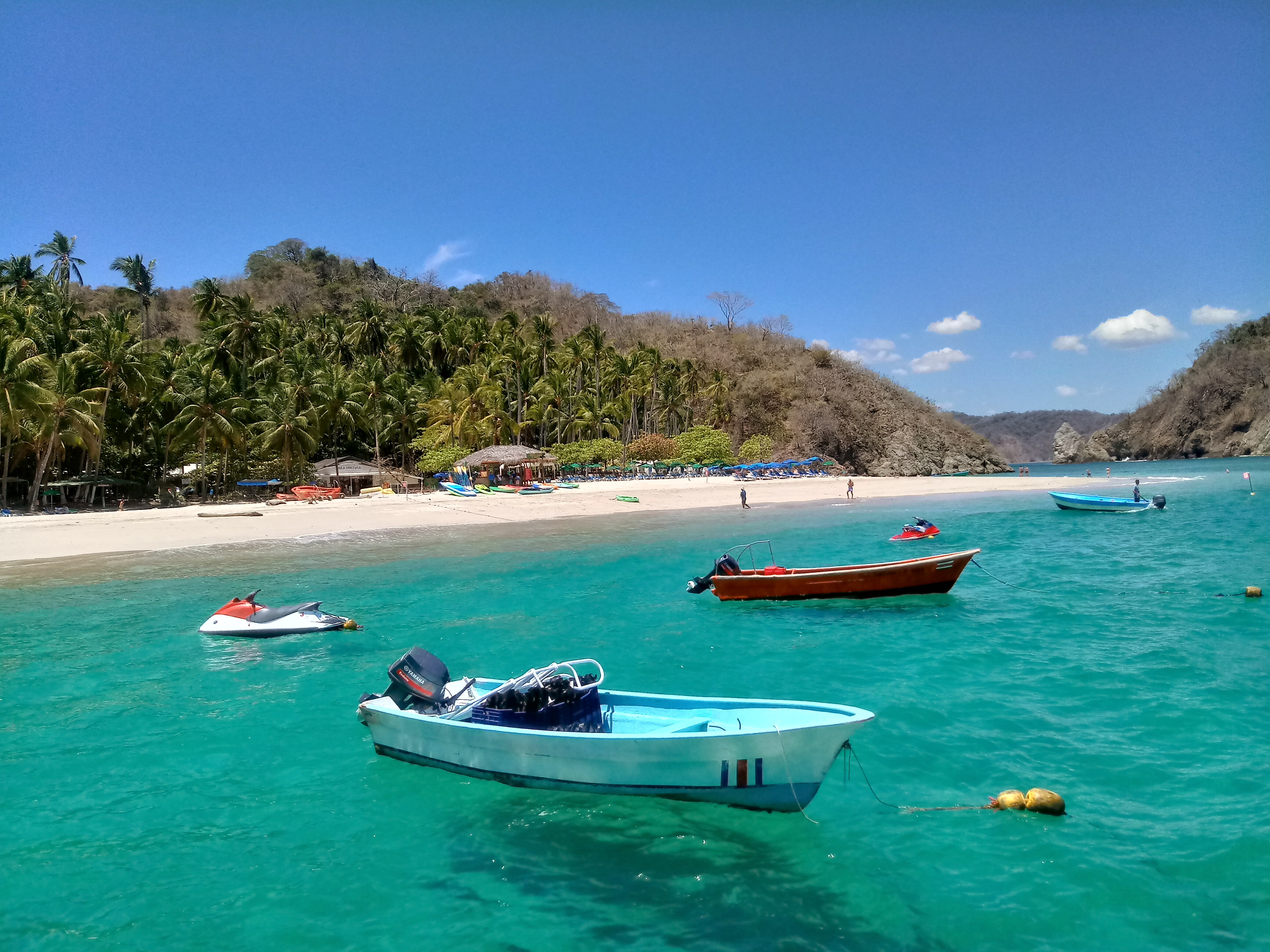 Isla Tortuga beach and boat ride, featuring scenic waterside views