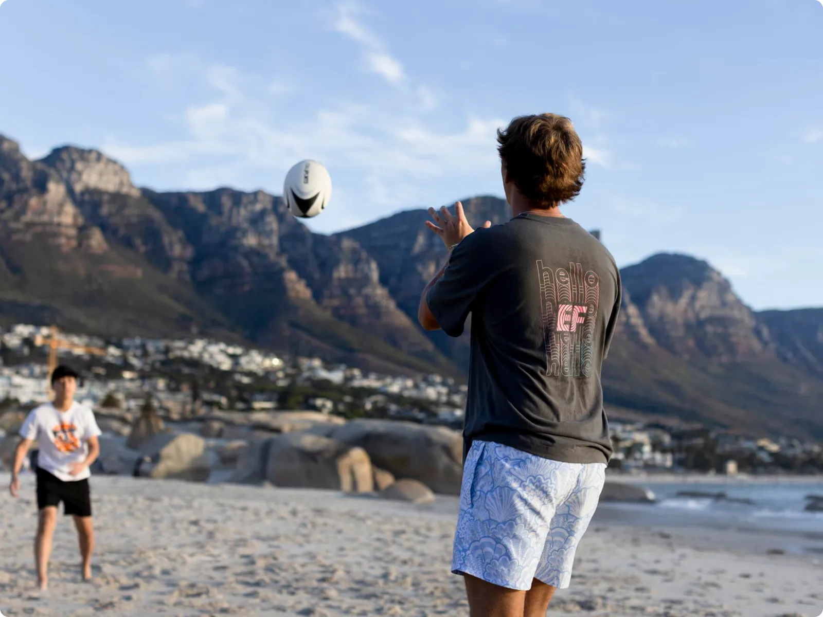 Playing Volleyball At Beach