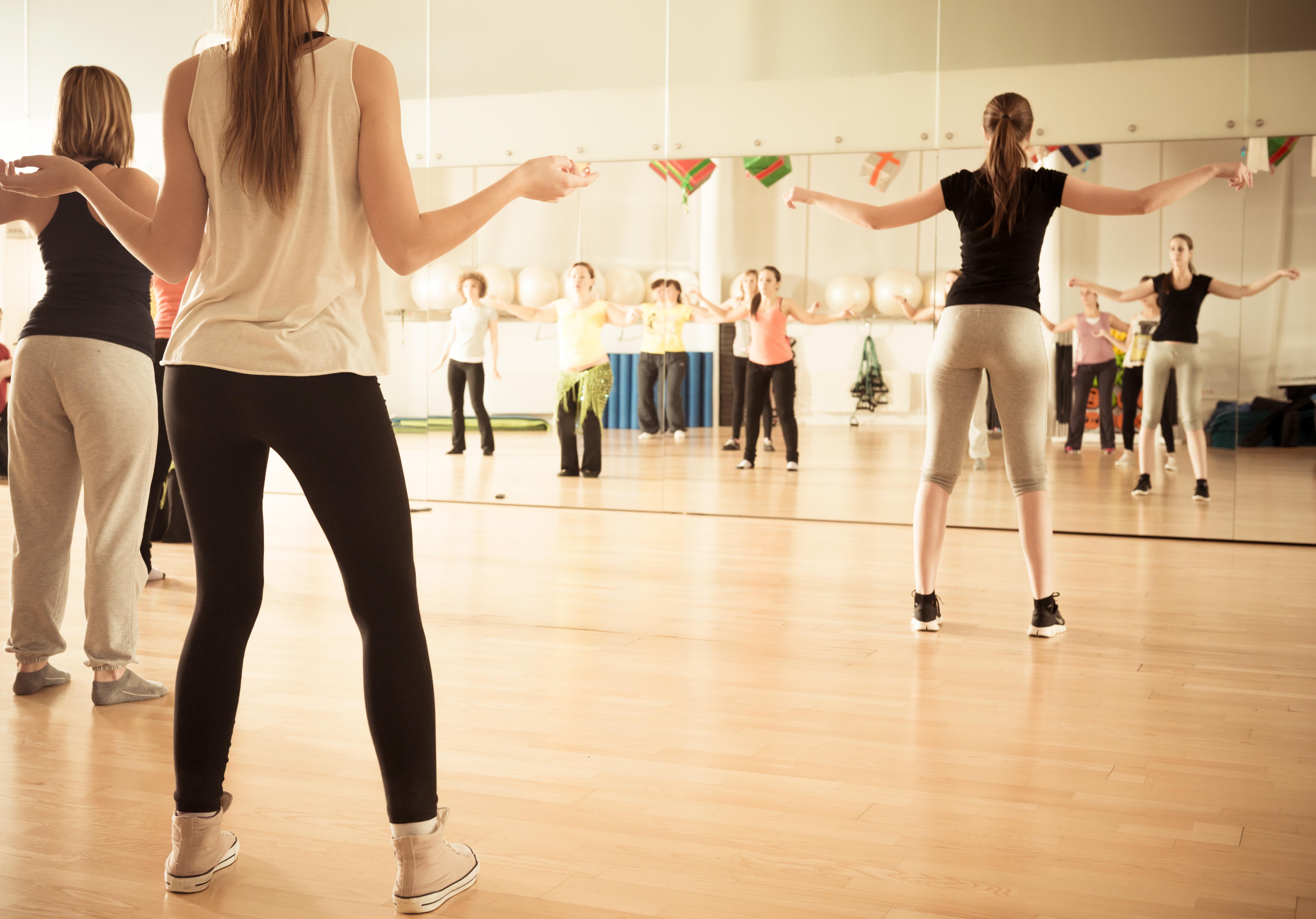 Students participate in a group fitness class, staying active and engaged in a fun, energetic environment