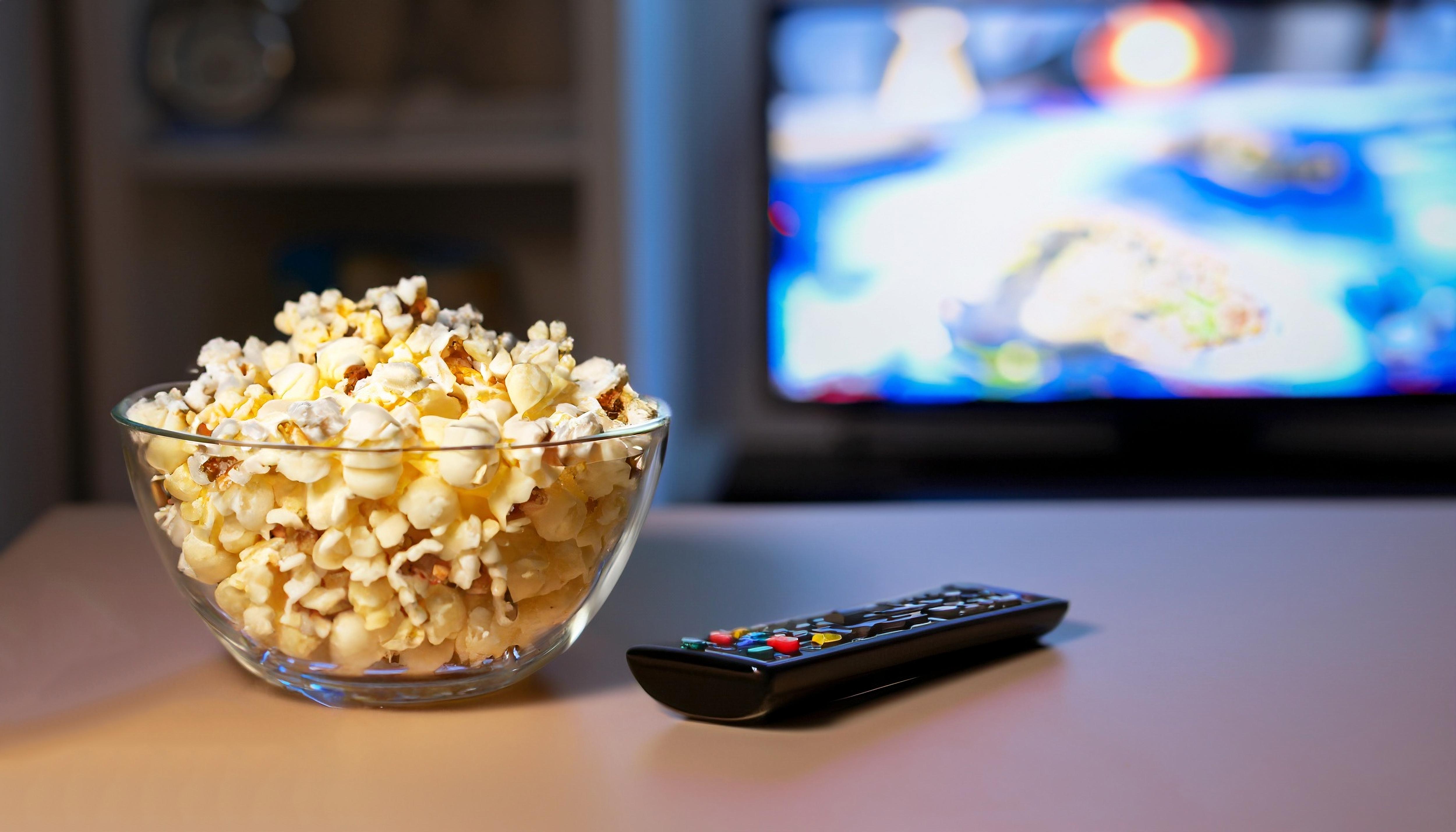 Movie night setup with popcorn, a television, and a relaxed atmosphere for entertainment and socializing