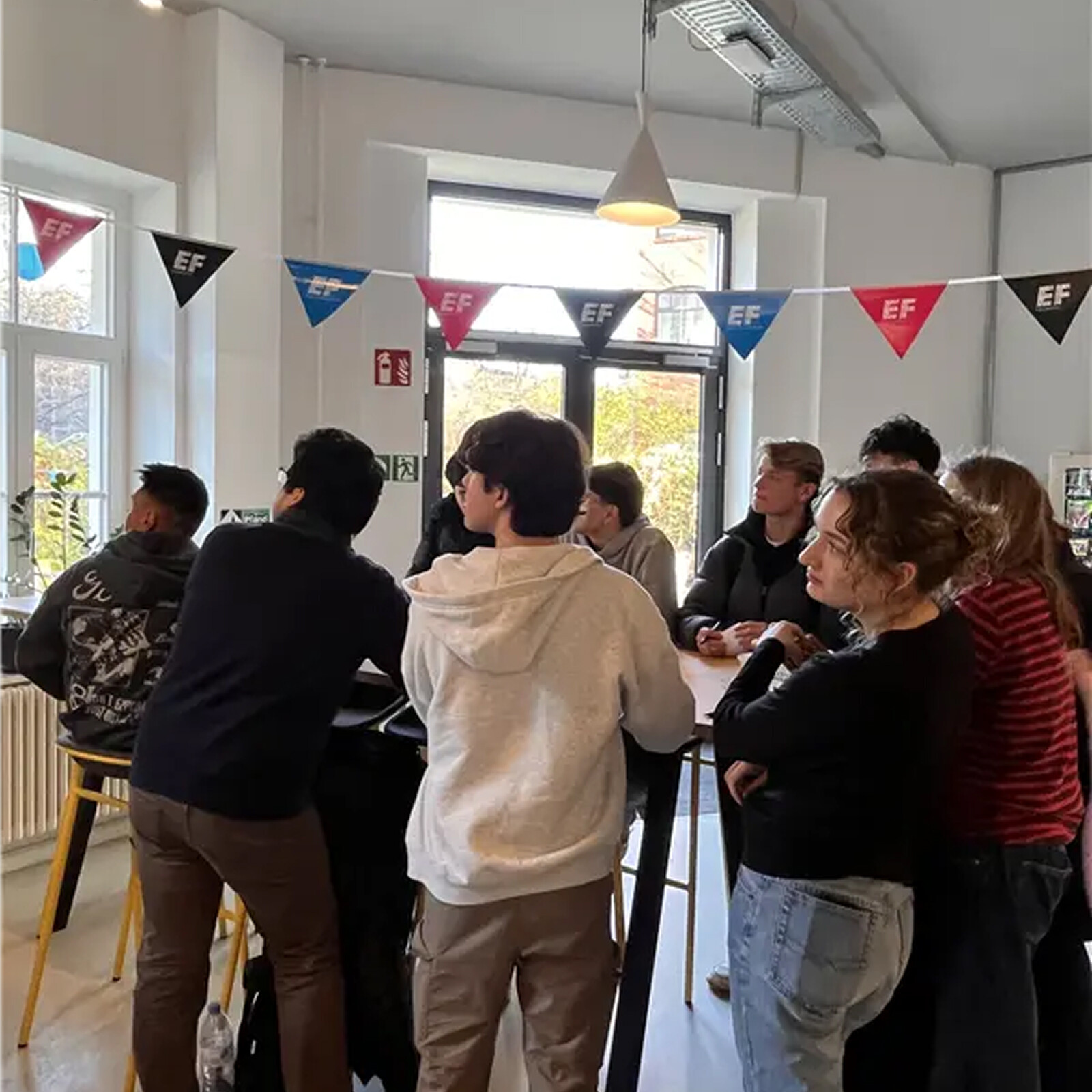Students connect and socialize at a campus event, enjoying conversation in a lively and welcoming community atmosphere