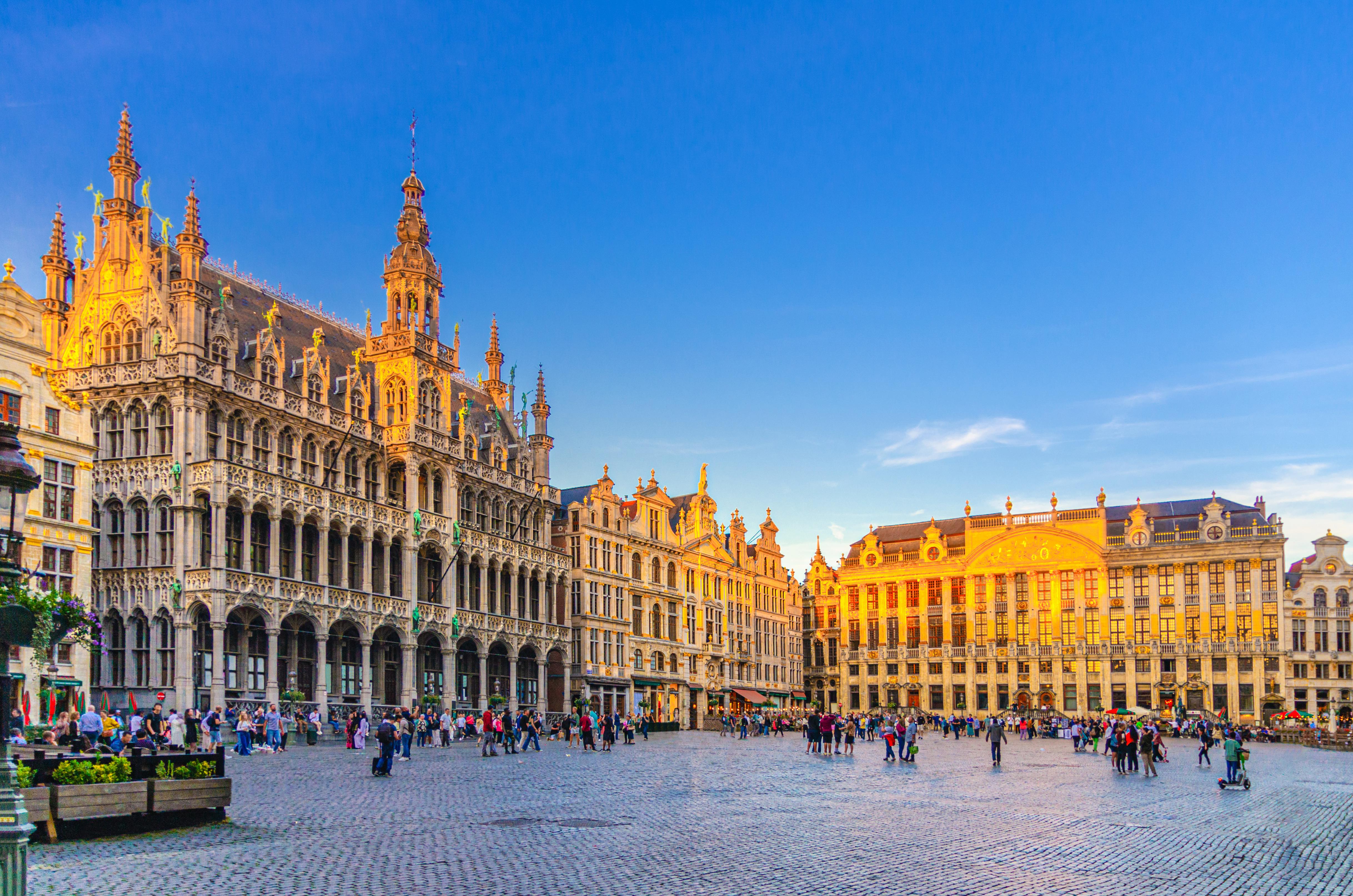 Grand Place and Brussels Town Hall glowing at sunset in Belgium
