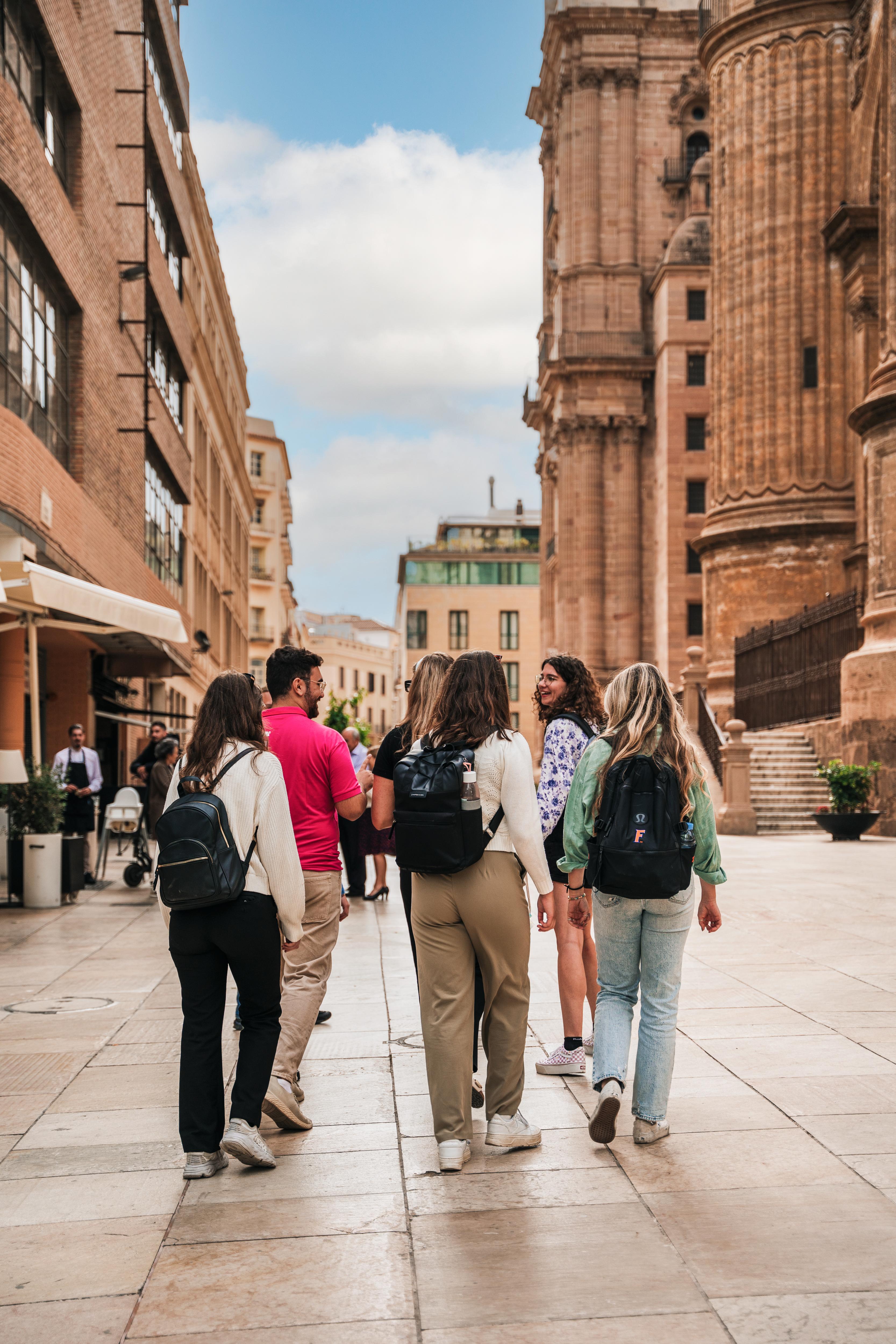 Students explore a vibrant European city, walking through historic streets
