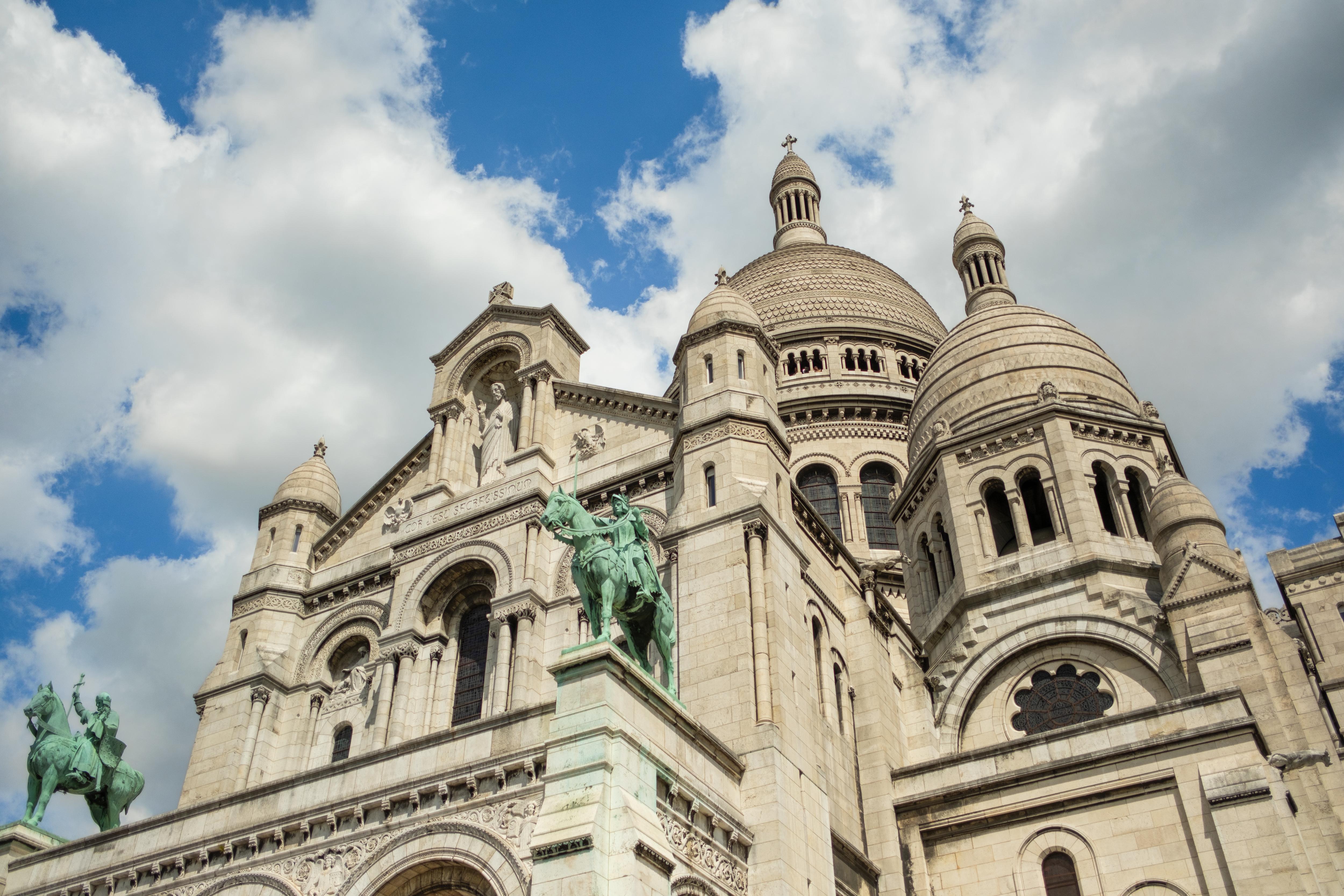 Basilica of the Sacred Heart, exploring its iconic architecture and enjoying panoramic views of Paris