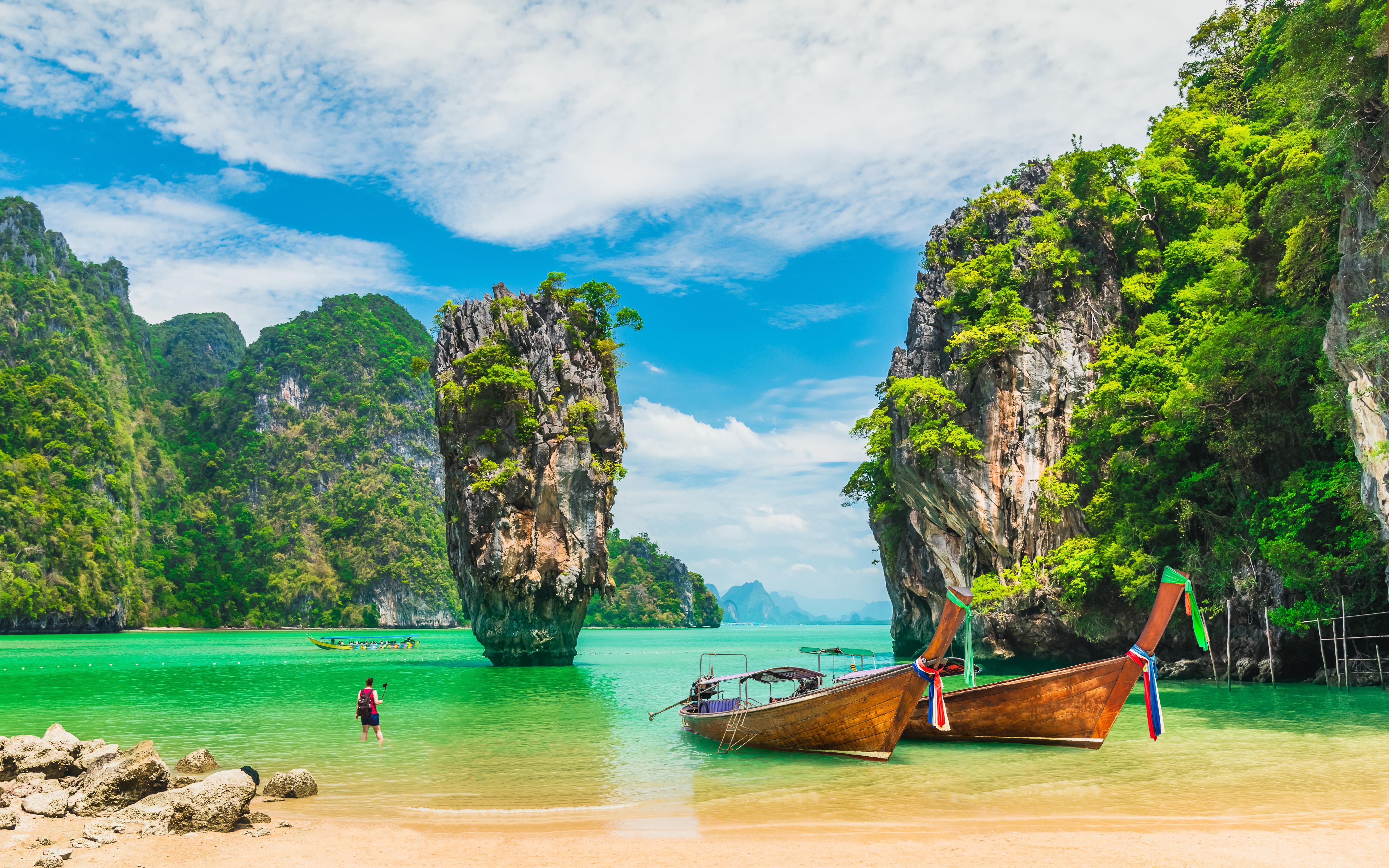 Long-Tail Boats Resting Along Khao Phing Kan’s Scenic Sandy Shore