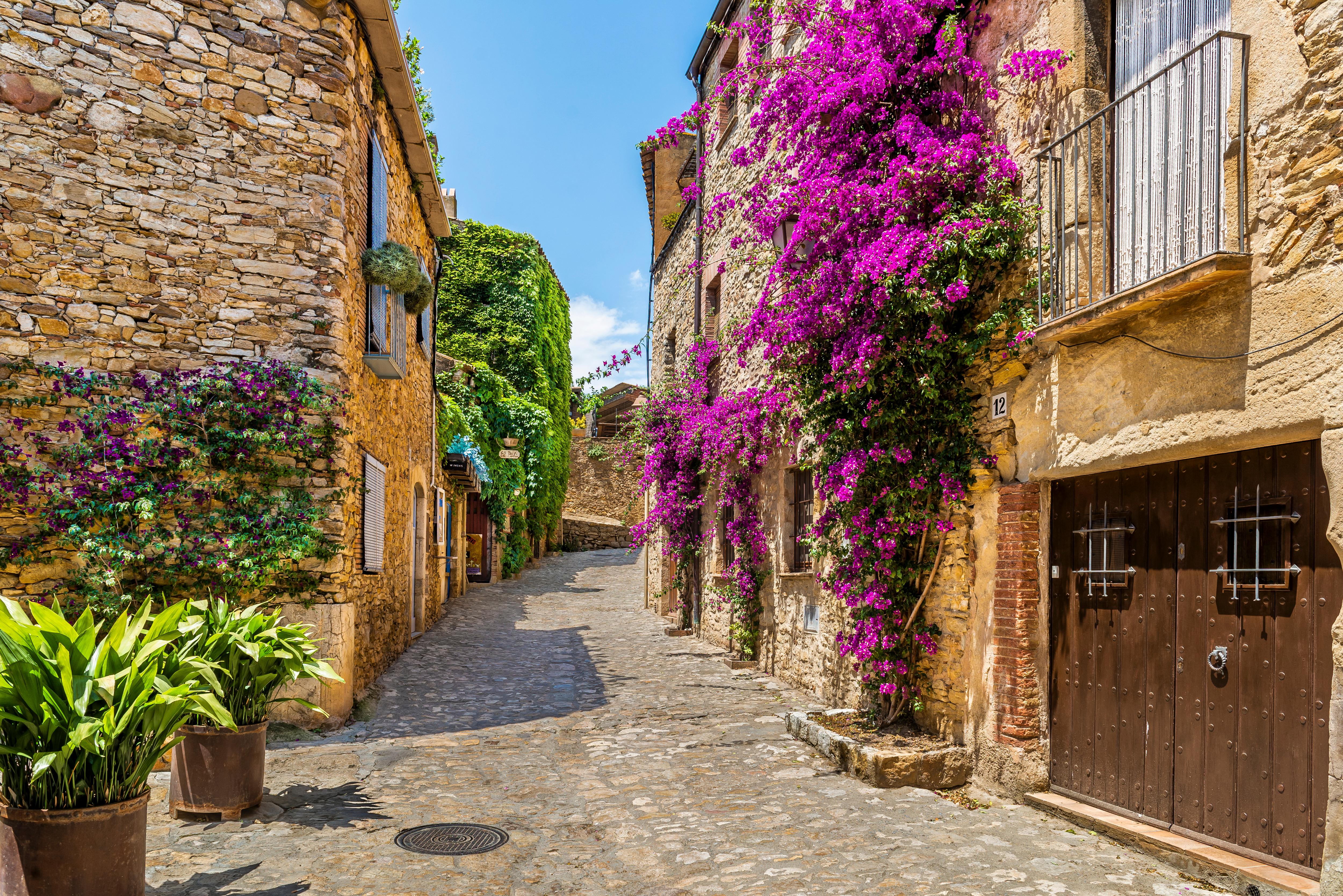 Peratallada’s cobblestone street, showcasing charming medieval architecture