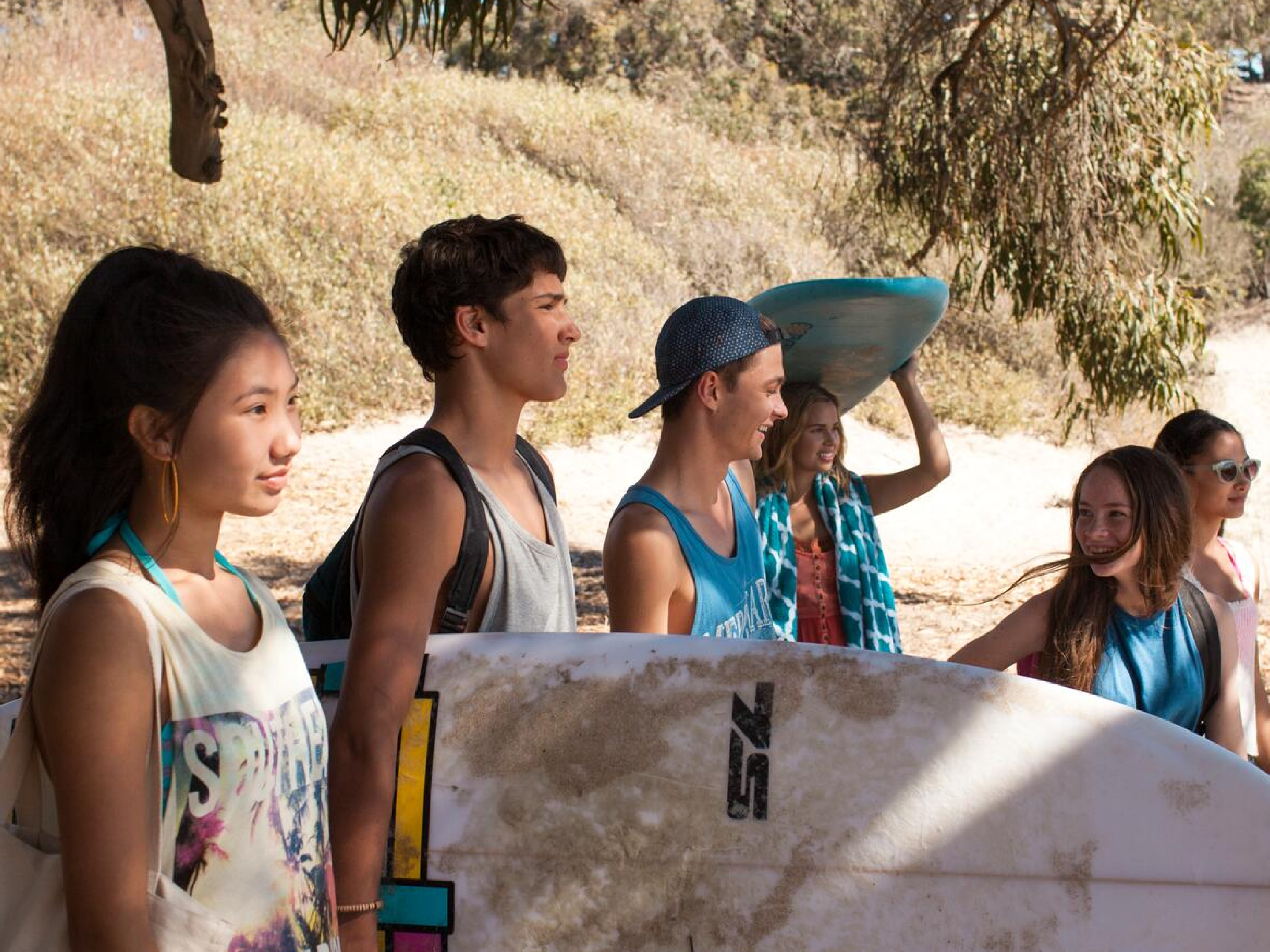 Students Holding Surfboard