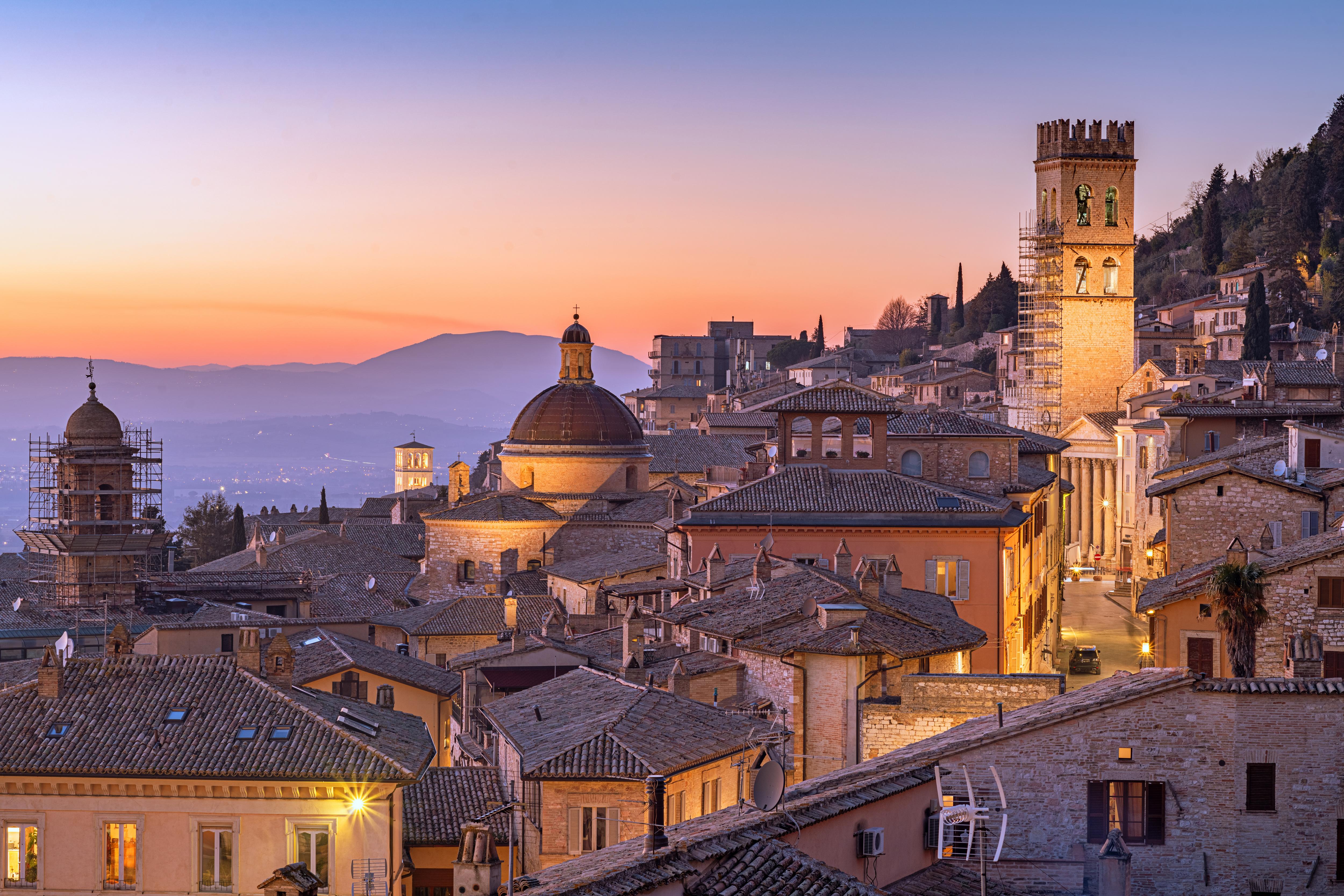 Night cityscape, church, mountain, and sunset view