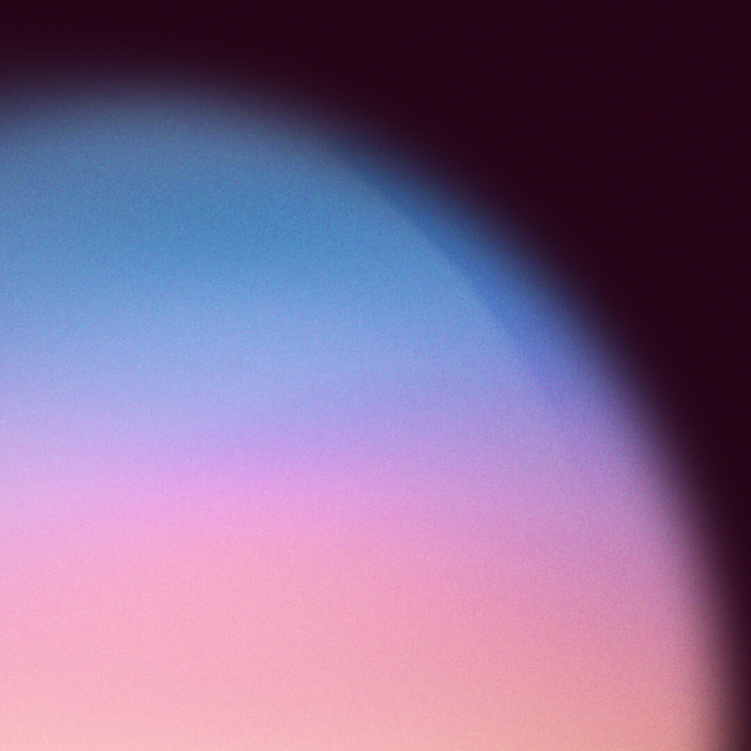 An abstract background featuring a gradient of blue, pink, and dark purple, evoking a sense of sunset or twilight.