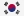 The image displays the flag of South Korea, known as the Taegukgi. It features a white background with a red and blue Taeguk symbol at its center, surrounded by four black trigrams.