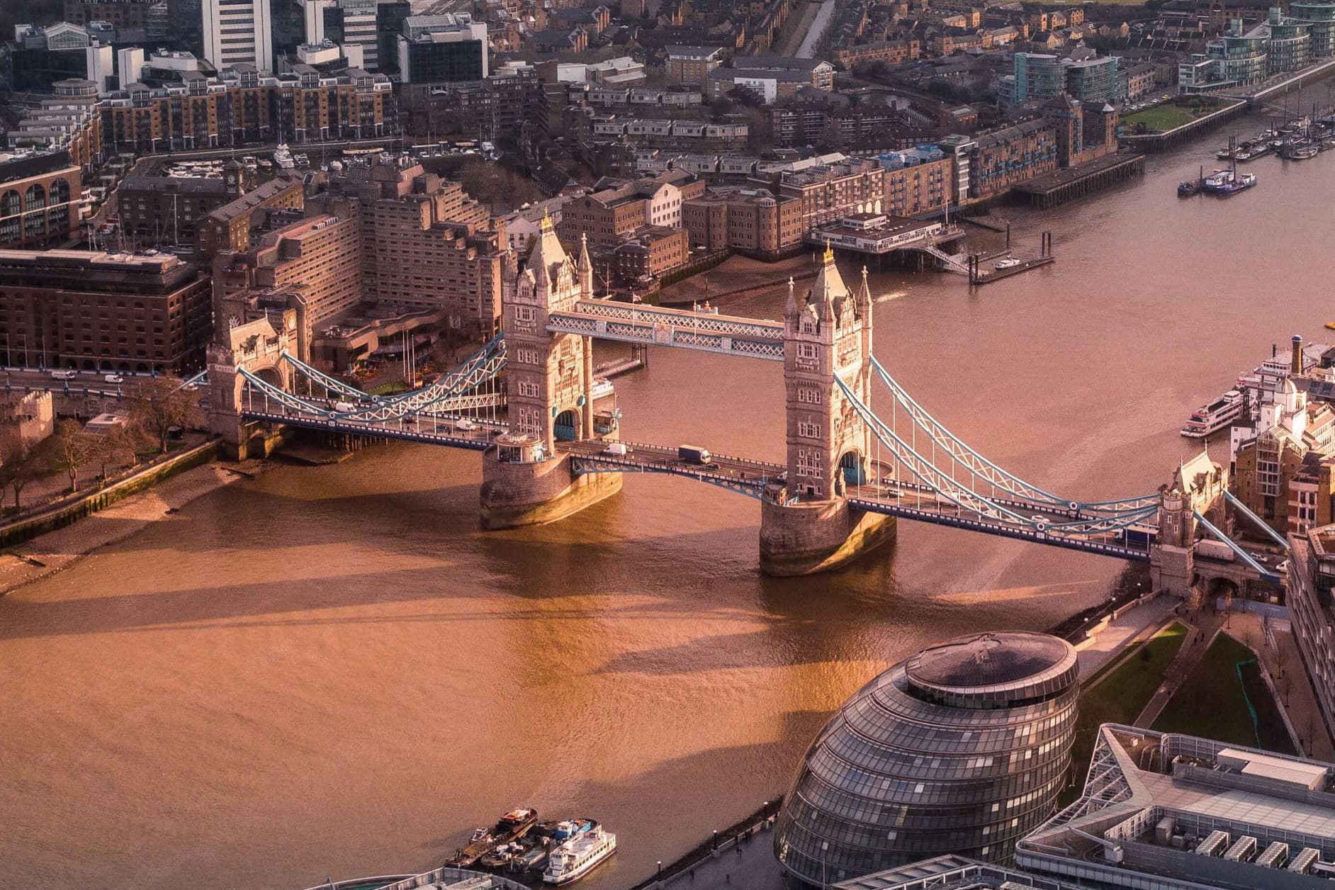 The Tower Bridge is an iconic bascule and suspension bridge over the River Thames in London, renowned for its Victorian Gothic Revival architecture, serving as a city landmark.