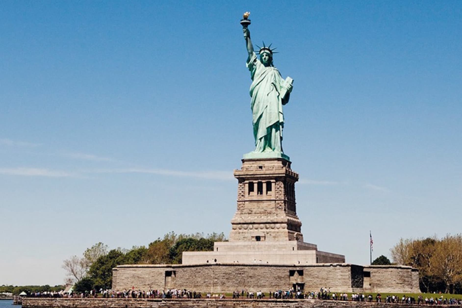 The image shows the Statue of Liberty, a colossal neoclassical sculpture on Liberty Island in New York Harbor, a gift from the people of France to the United States.