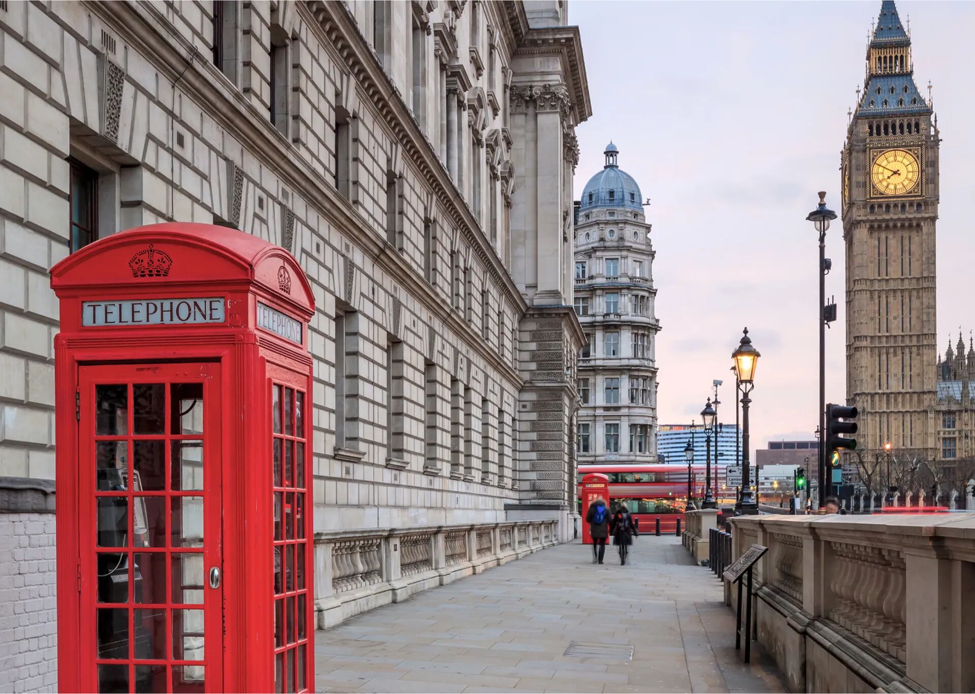 This is an iconic image of London, featuring a red telephone box in the foreground and Big Ben in the background, captured during twilight.